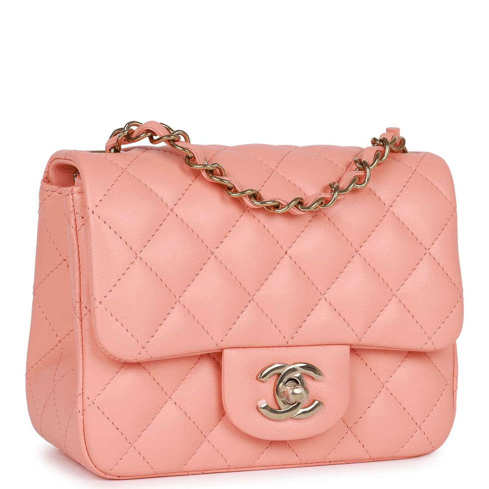 Three-quarter front view of the pink lambskin bag showing the light gold chain strap