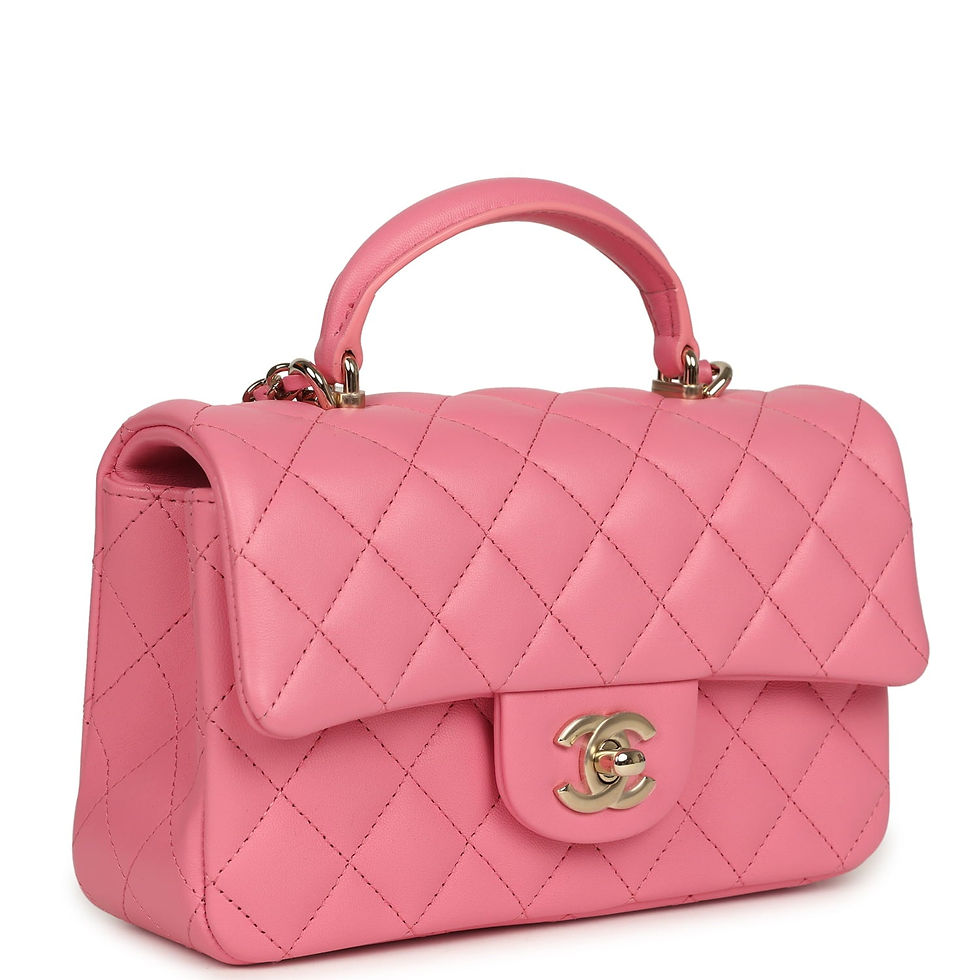 Three-quarter front view of the pink lambskin bag showing the rounded top handle