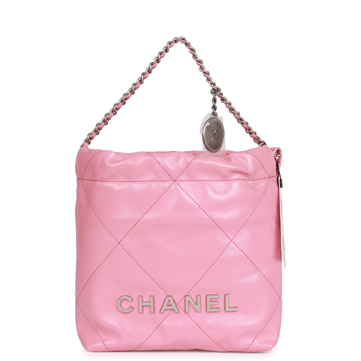 Chanel 22 Mini bag in pink calfskin with silver-tone chain strap and CHANEL PARIS charm