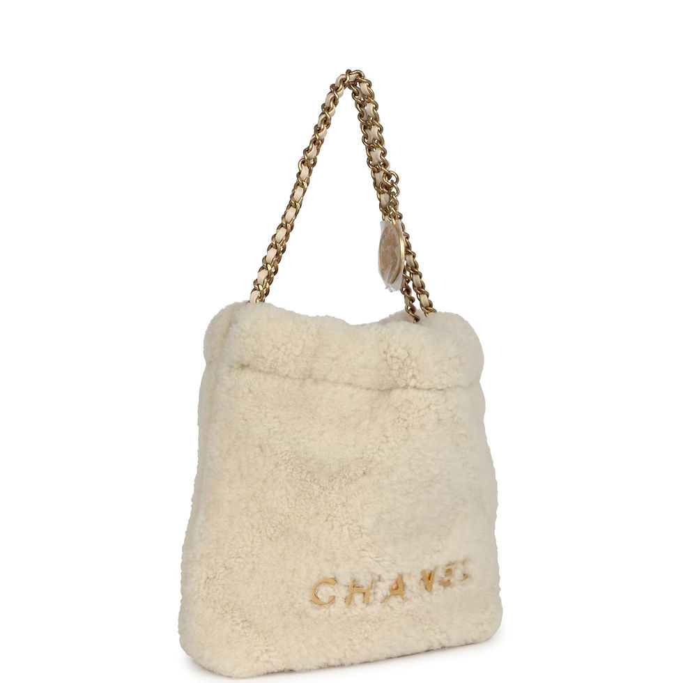 Angled front view of the ecru shearling bag showing the rubberised CHANEL wordmark
