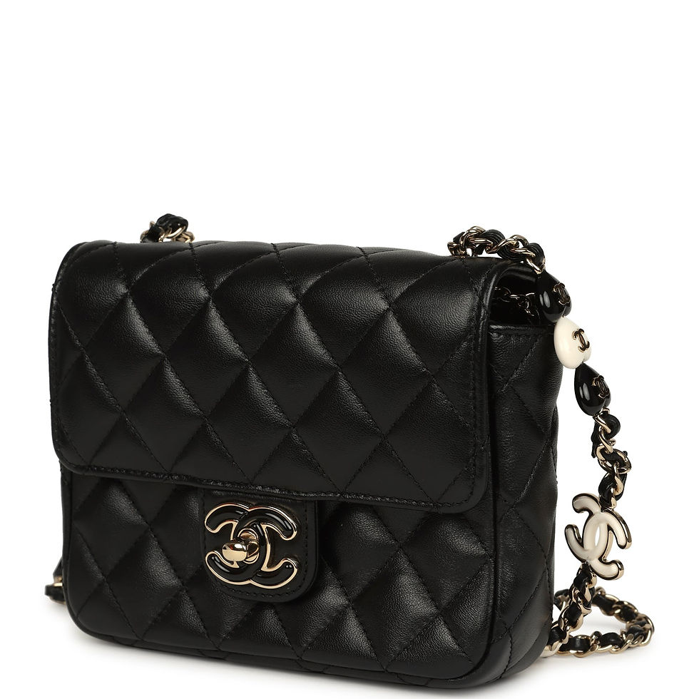 Thumbnail: Angled view highlighting the black-and-ivory enamel heart charms along the beaded strap