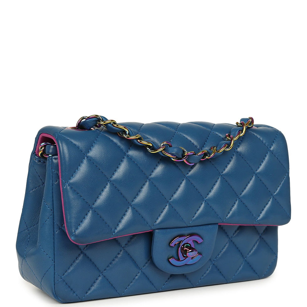 Three-quarter angled view showing the diamond-quilted blue lambskin and rainbow-tone chain strap