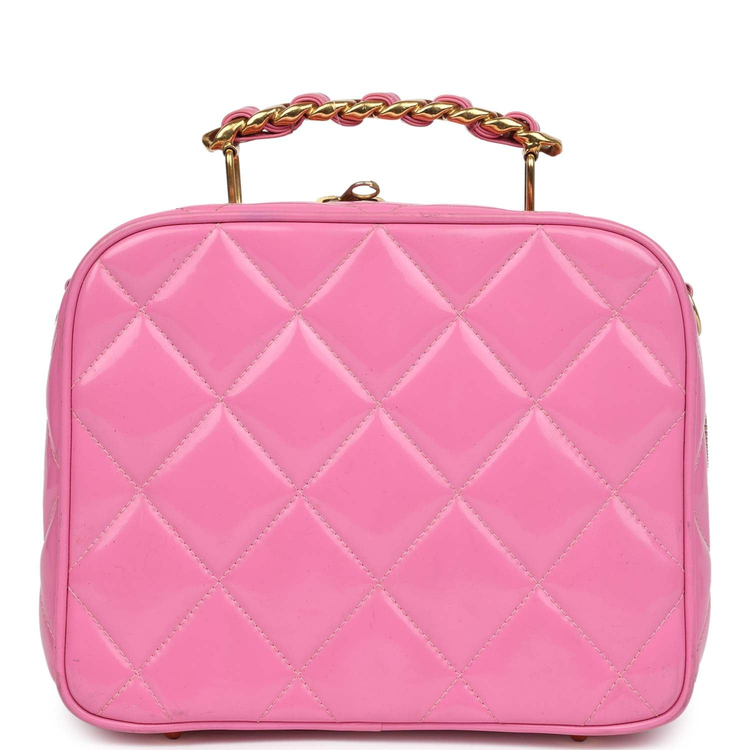 Front view of the pink patent lunchbox vanity bag with quilted stitching