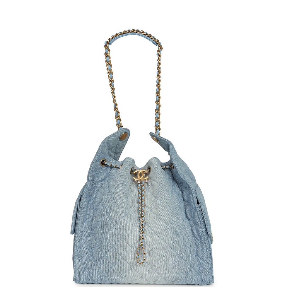 Thumbnail: Front view of the denim hobo bag carried by its leather-topped chain handle
