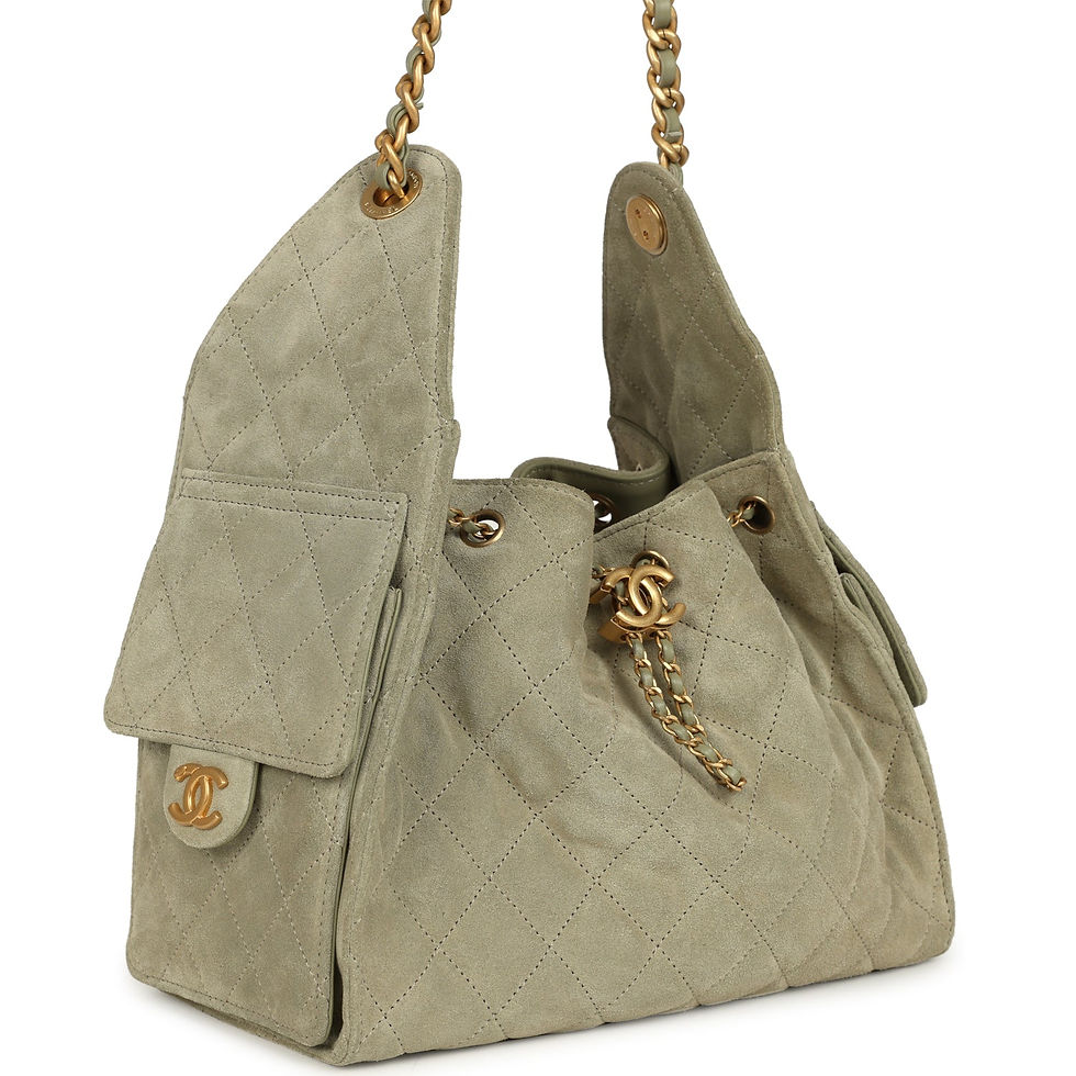 Three-quarter view of the olive green suede hobo bag showing the side flap pocket