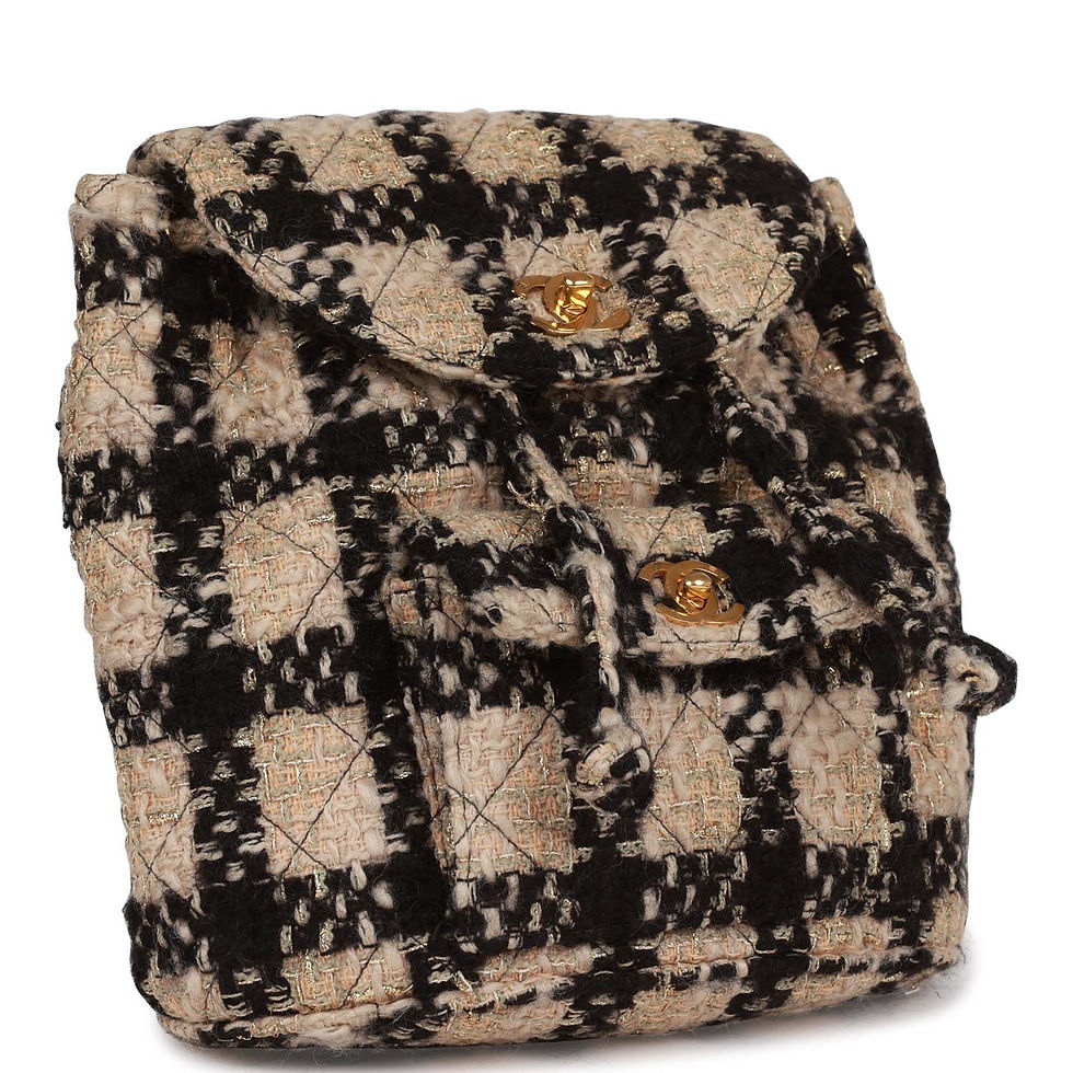 Close front view showing the drawstring top and twin flap pockets in woven tweed