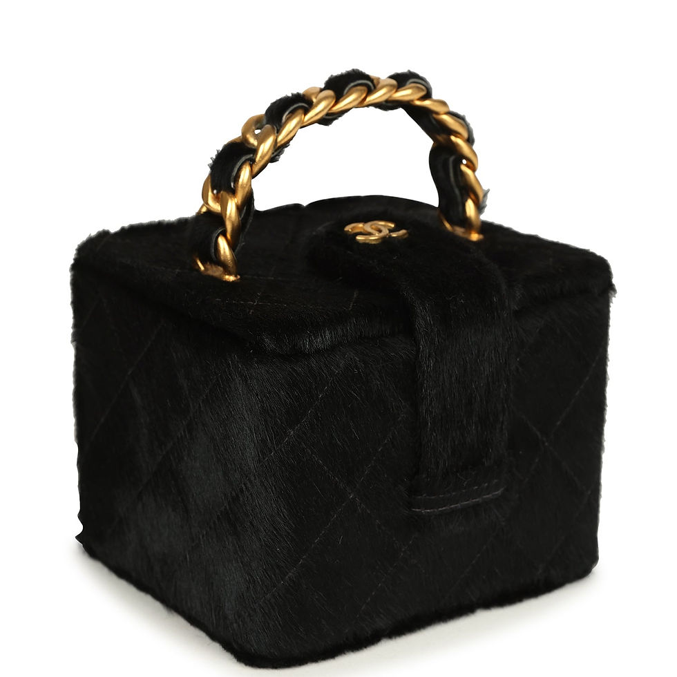 Three-quarter angle showing the boxy silhouette and woven chain-and-ponyhair handle