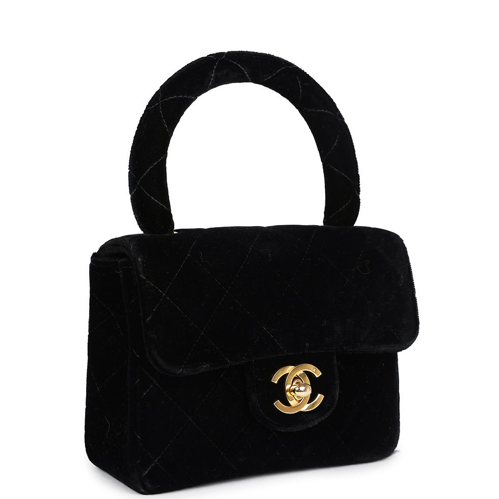 Angled front view of the black velvet Micro Kelly Child bag and top handle