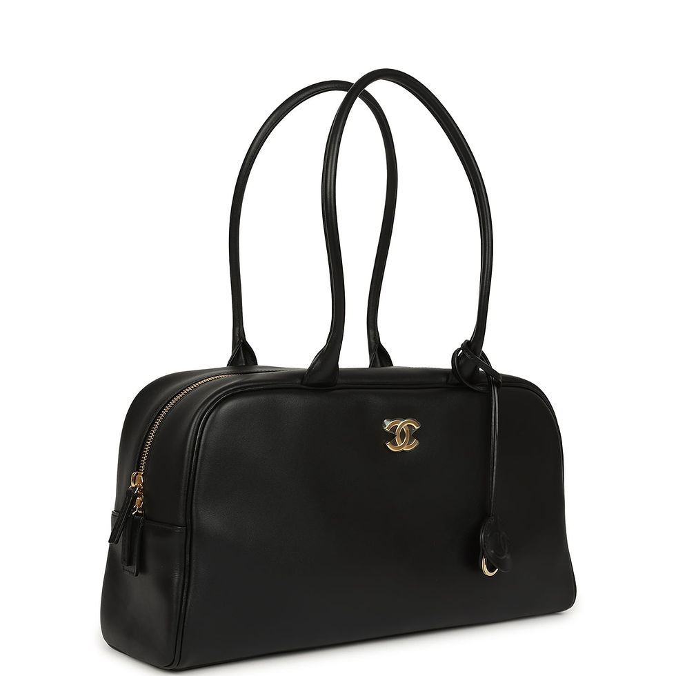Side-angle view showing the bag's rolled top handles and CC charm