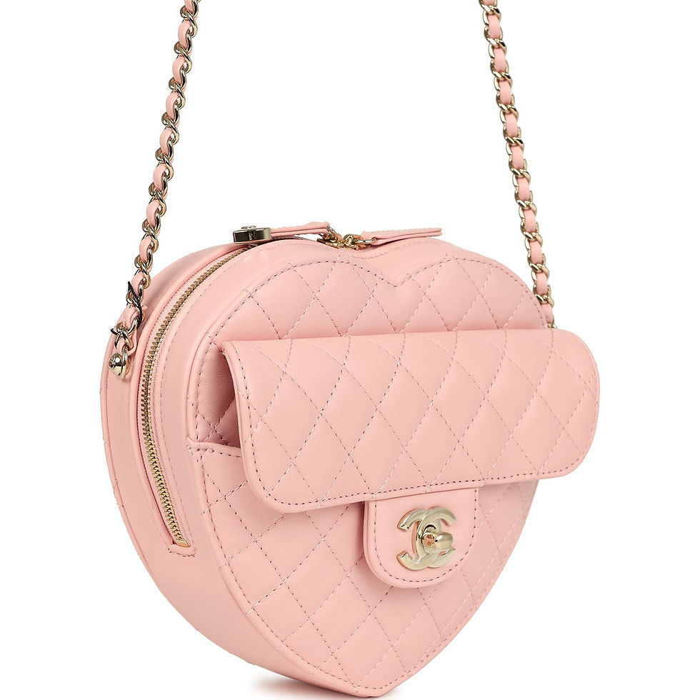 Three-quarter view of the pink heart bag showing the zip-top opening and chain strap