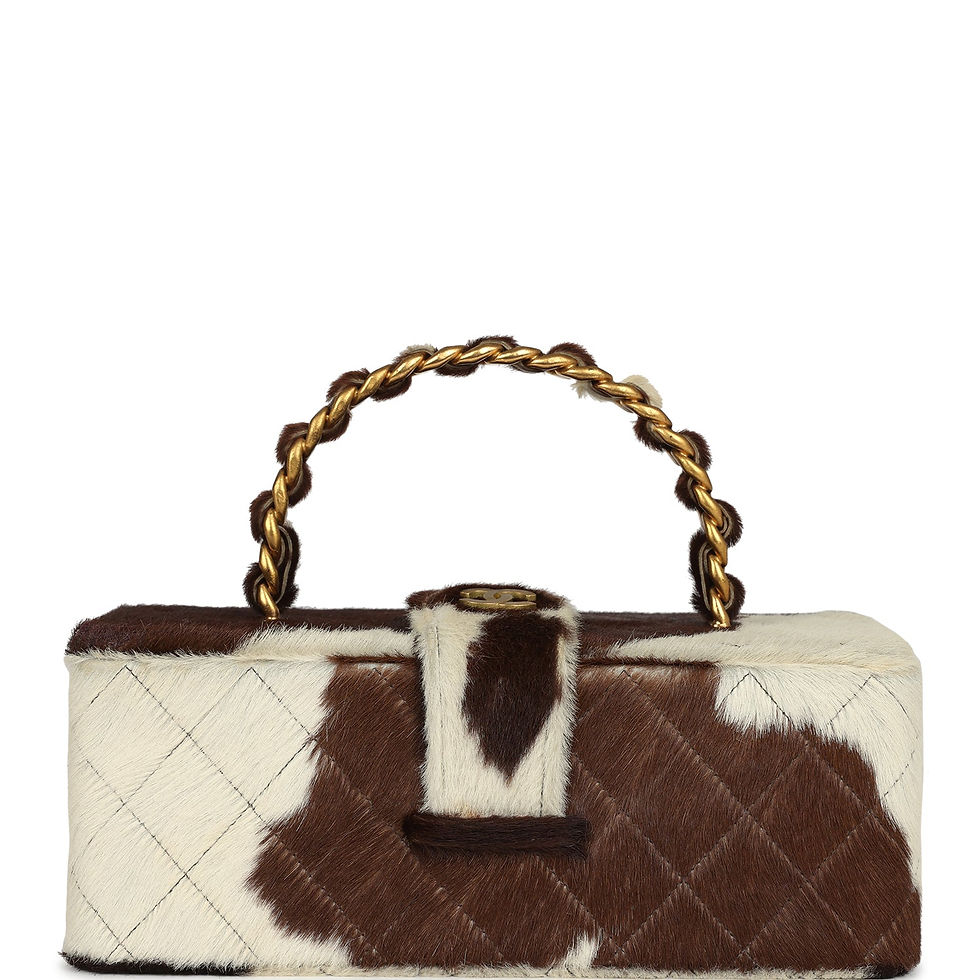 Front view of the cow-print ponyhair vanity box with gold-tone chain handle