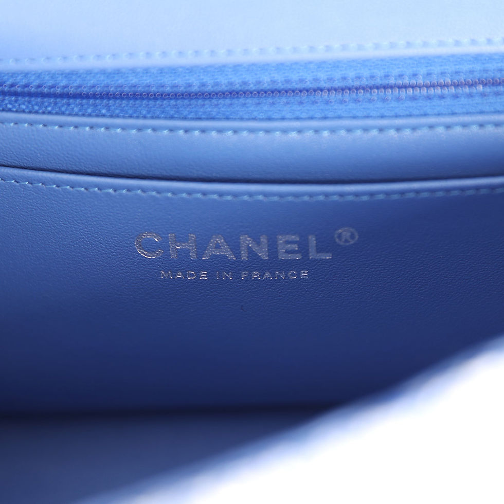 Thumbnail: Close-up of the silver-stamped Chanel Made in France signature inside the bag
