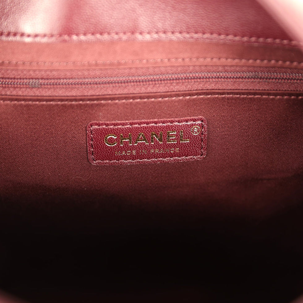 Thumbnail: Close-up of the leather interior tab stamped Chanel Made in France