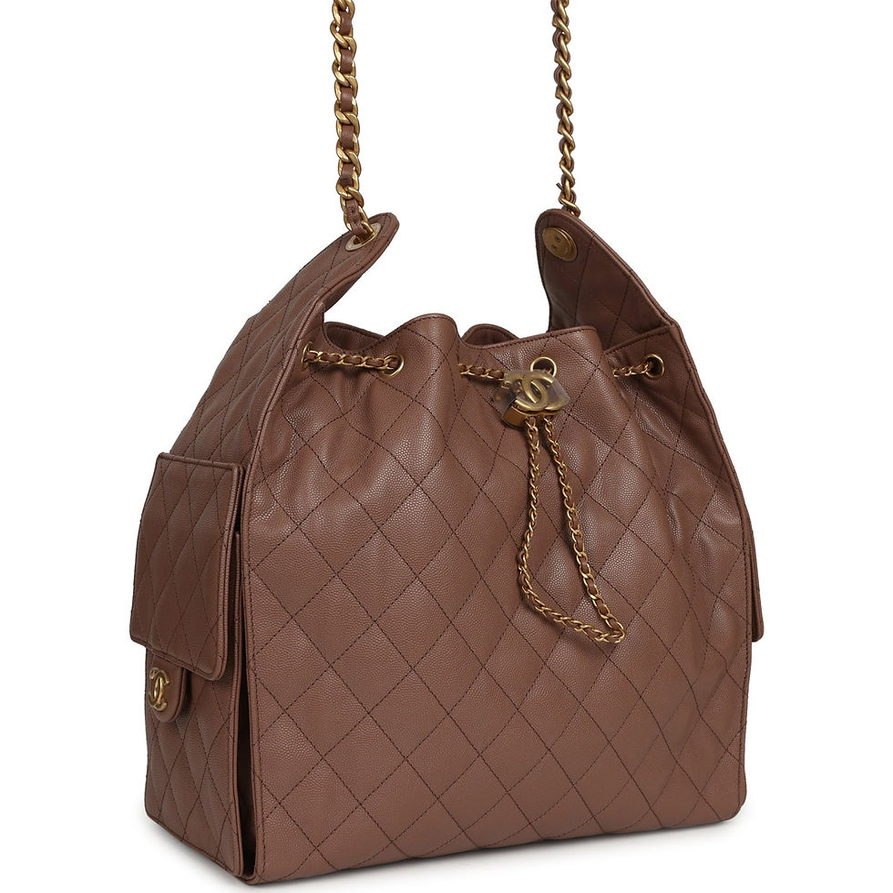 Angled front view of the brown quilted hobo showing chain drawstring and side pocket