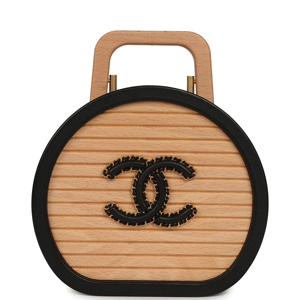 Front view of the round beechwood vanity case with black calfskin trim