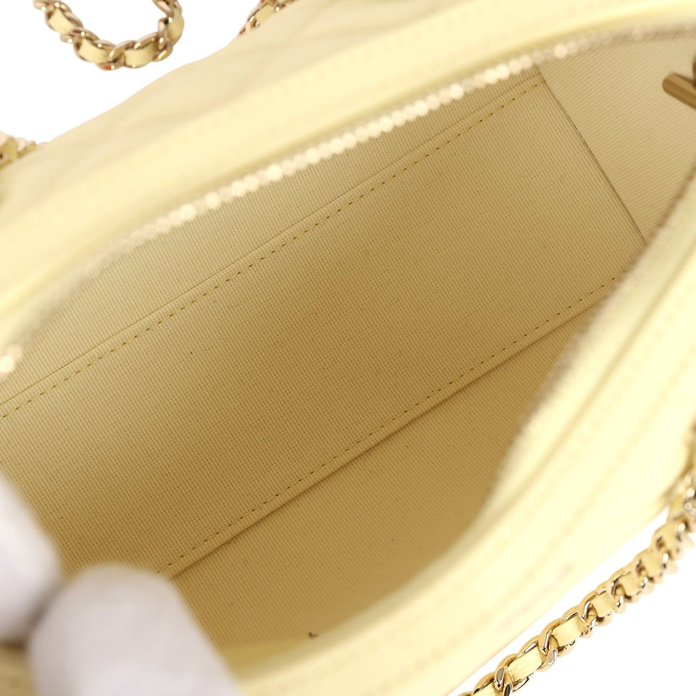 Thumbnail: Open interior of the pale yellow Chanel Mini Timeless Barrel bag