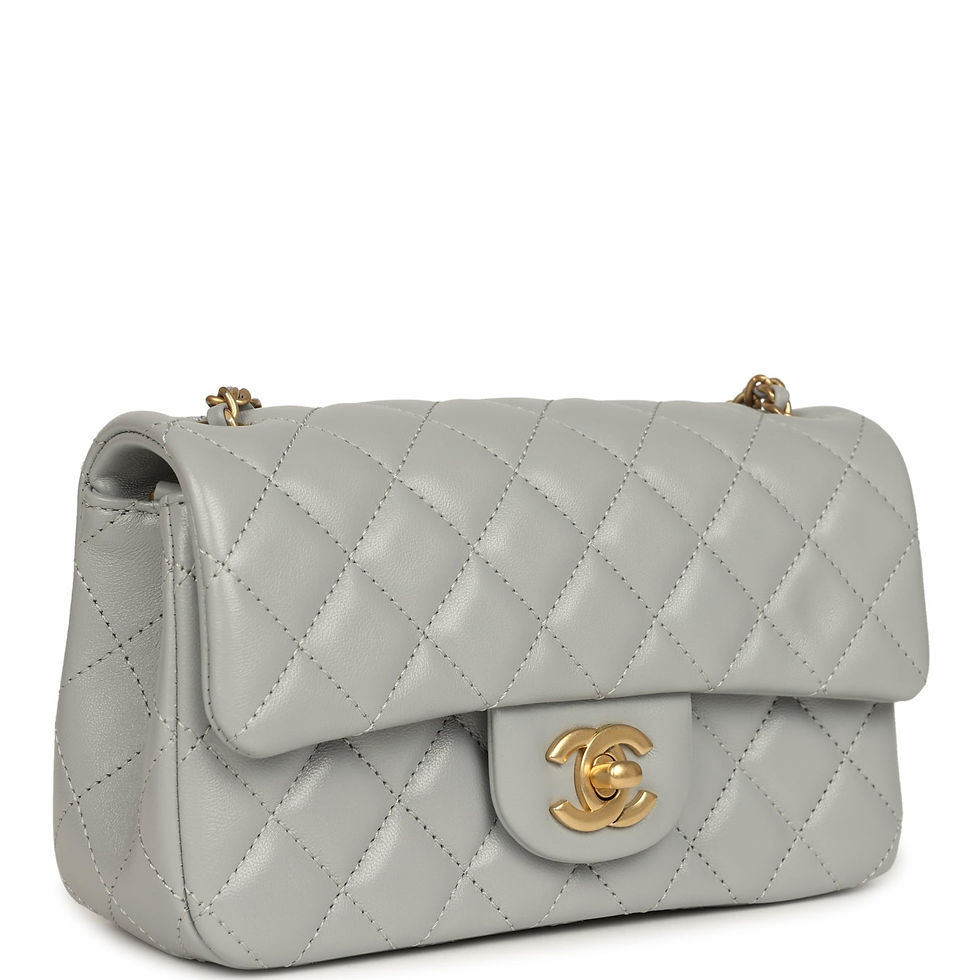 Three-quarter front view of the grey quilted lambskin bag showing the diamond stitching and gold chain strap