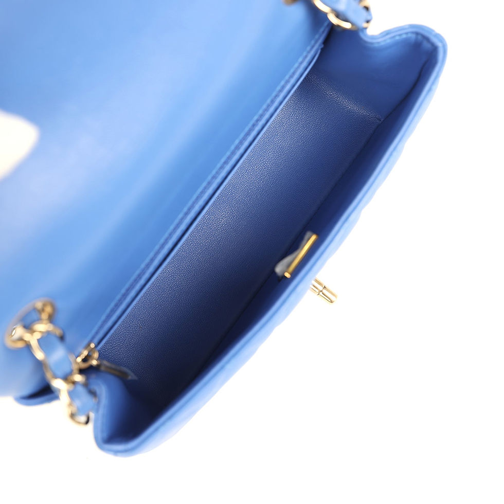 Thumbnail: Close-up interior view in blue leather showing the zipped pocket