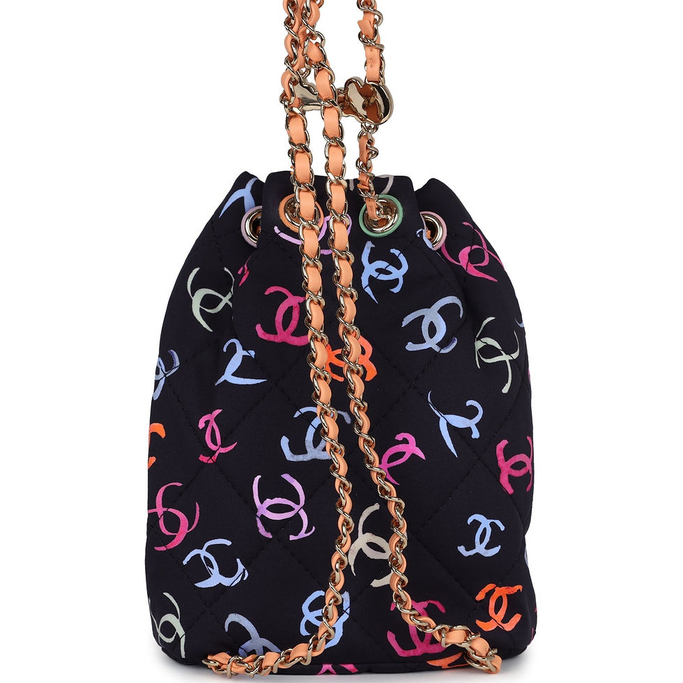 Thumbnail: Close-up of the drawstring closure with coral resin toggle on the printed fabric backpack
