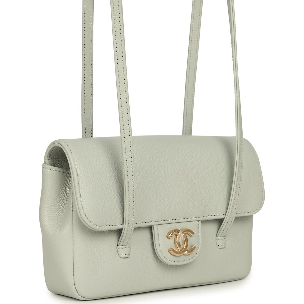 Angled view of Chanel light green Preppy Coco flap bag showing gold CC clasp