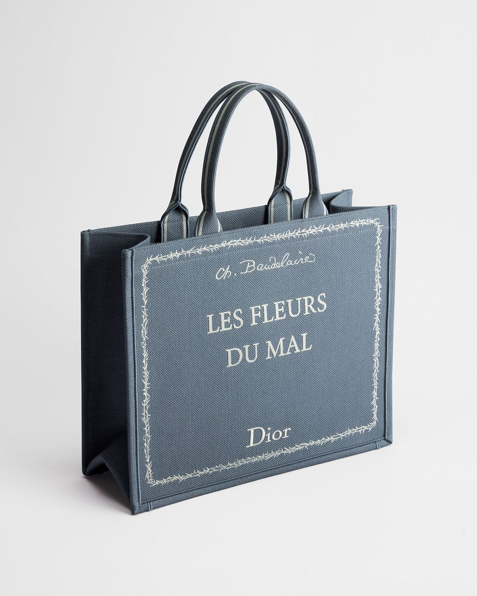 Thumbnail: Dior Large Book Tote in blue embroidered canvas with Les Fleurs du Mal cover – three-quarter view
