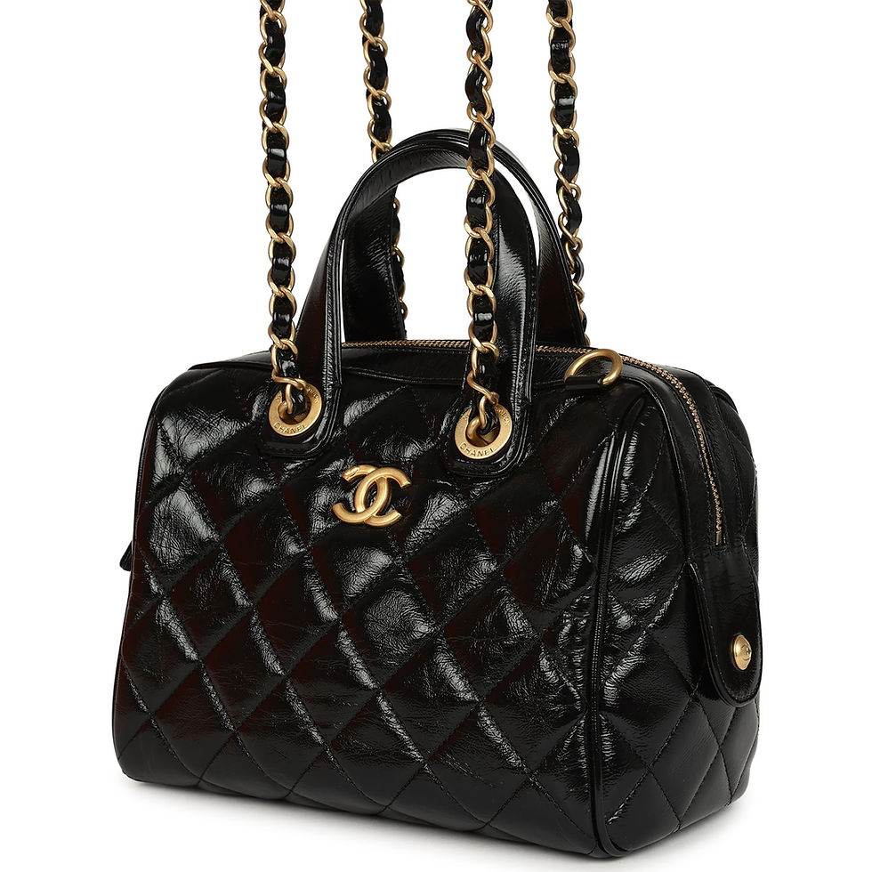 Thumbnail: Angled rear view showing the bag's rolled handles and silhouette