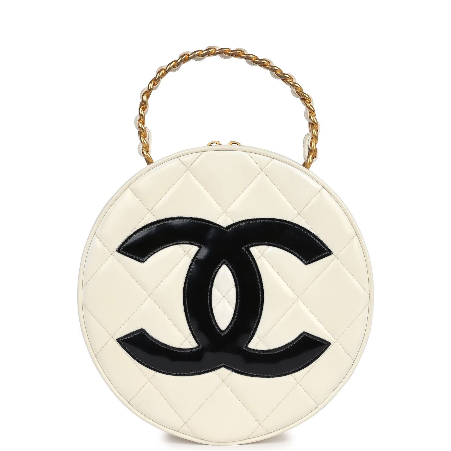Front view of the round vanity bag in white quilted patent leather with a black CC