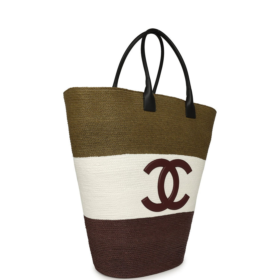 Three-quarter view of the tote showing the black calfskin handles and colour-blocked body