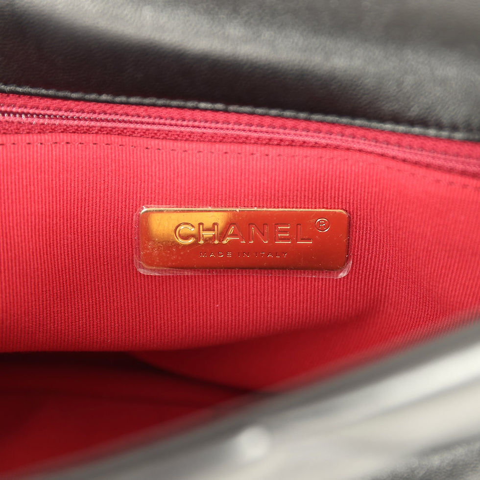 Thumbnail: Close-up of the Chanel Made in Italy stamp on the red interior lining
