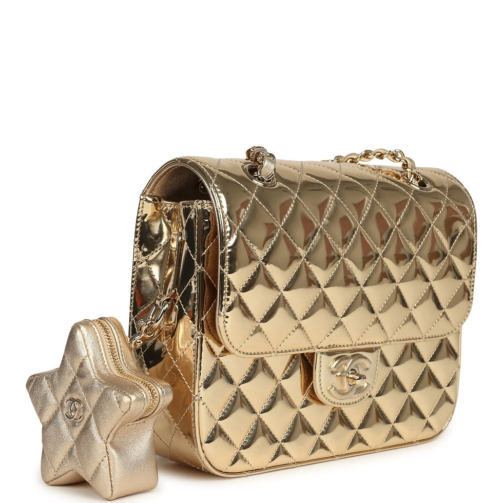 Three-quarter view of the gold mirror backpack showing the quilted flap and chain strap