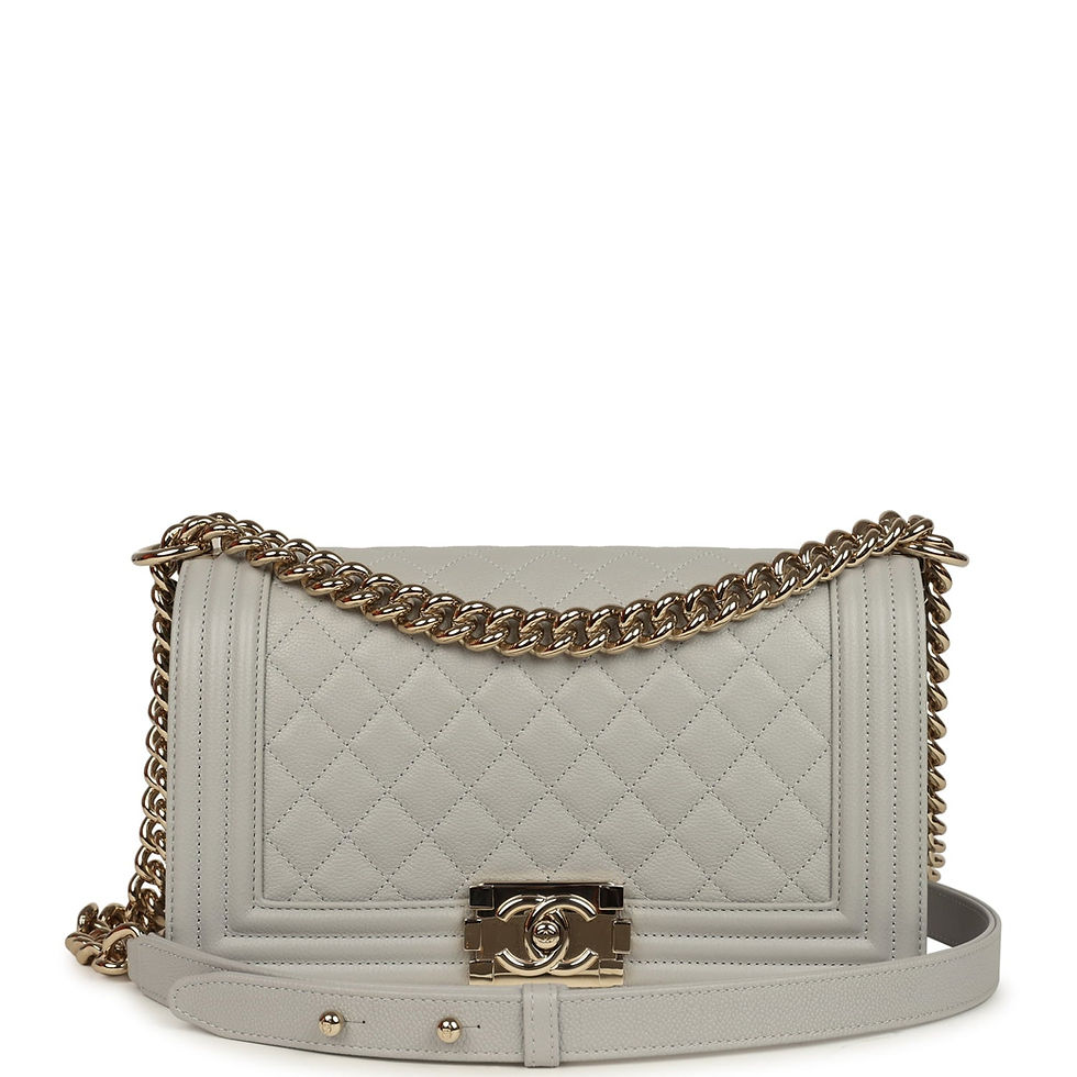 Front view of the Chanel Medium Boy bag in light grey caviar with its chain draped across the flap