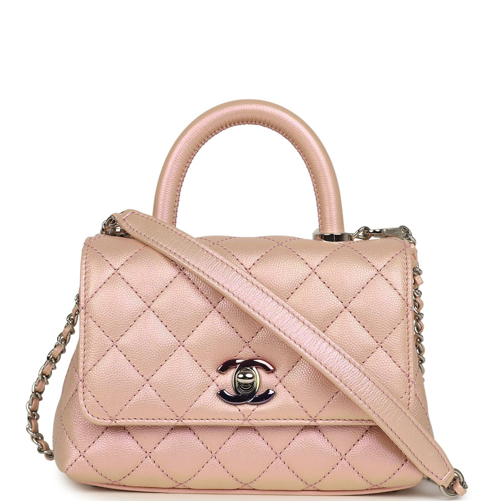 Front view of an iridescent pink caviar Chanel Coco Handle micro bag with top handle