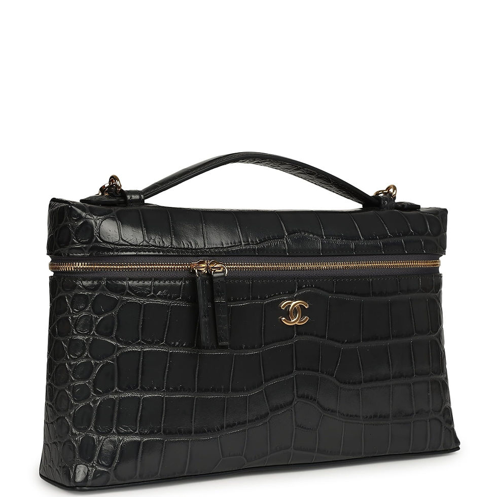 Three-quarter angled view of the croc-embossed vanity case showing the gold-tone CC turnlock