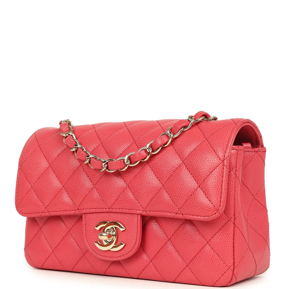 Thumbnail: Three-quarter angle of the coral-pink Chanel Mini Rectangular Flap bag with strap raised