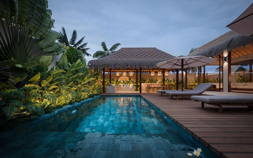 Private swimming pool and sun loungers at a tropical villa for sale Serangan Lombok.