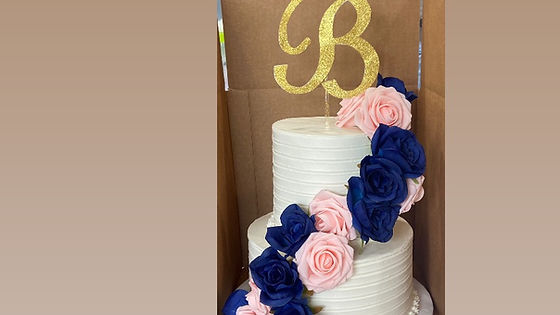 2 tier w/swag of flowers Wedding Cake