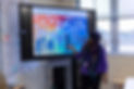 A QPR trainer presenting in front of a projected screen