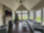 A cozy family room with lots of windows.