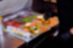 Deli chef preparing juicy cheesesteak and burger