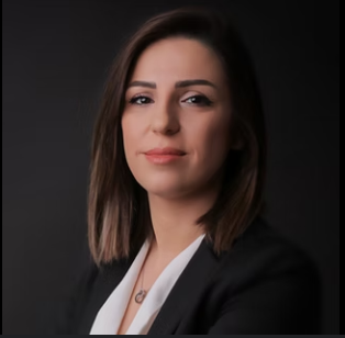 Professional headshot of a woman in a black blazer.