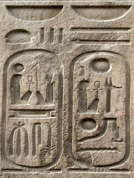 Ancient Egyptian stone carvings featuring astrological symbols and celestial imagery representing the origins and history of Ancient Astrology.