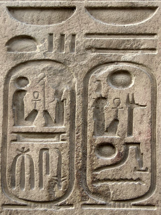Ancient Egyptian stone carvings featuring astrological symbols and celestial imagery representing the origins and history of Ancient Astrology.