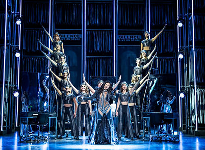 Debbie Kurup as Star (centre) and cast in The Cher Show, credit Pamela Raith.jpg