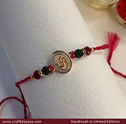 Golden-om-with-stones-rakhi.jpg