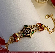 Om-with-rudraksha-bracelet-rakhis-in-gold.jpg