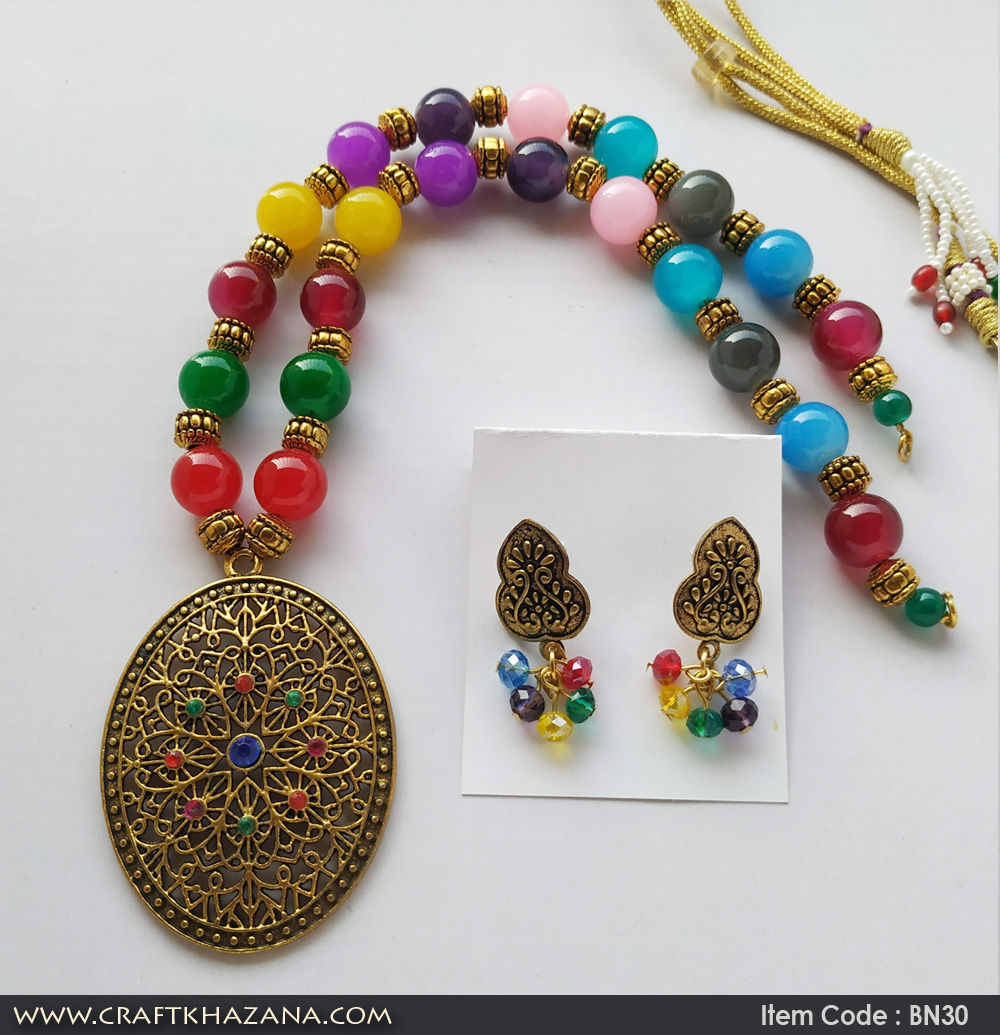Kavya, multi color beaded necklace set with gold tone pendant.