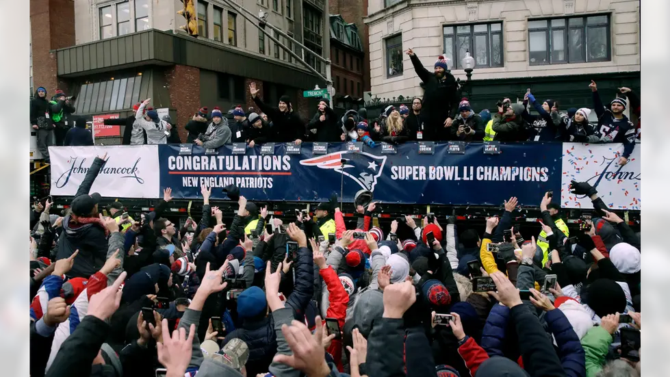 Super Bowl Champions banner stretched across a Duck Boat during the New England Patriots victory parade.