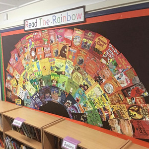 Primary school rainbow book display featuring All in a Flap by Francesca Watt