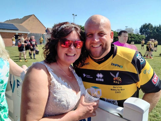 Rugby-loving bride cheers husband on from sidelines in her wedding dress hours after marrying him