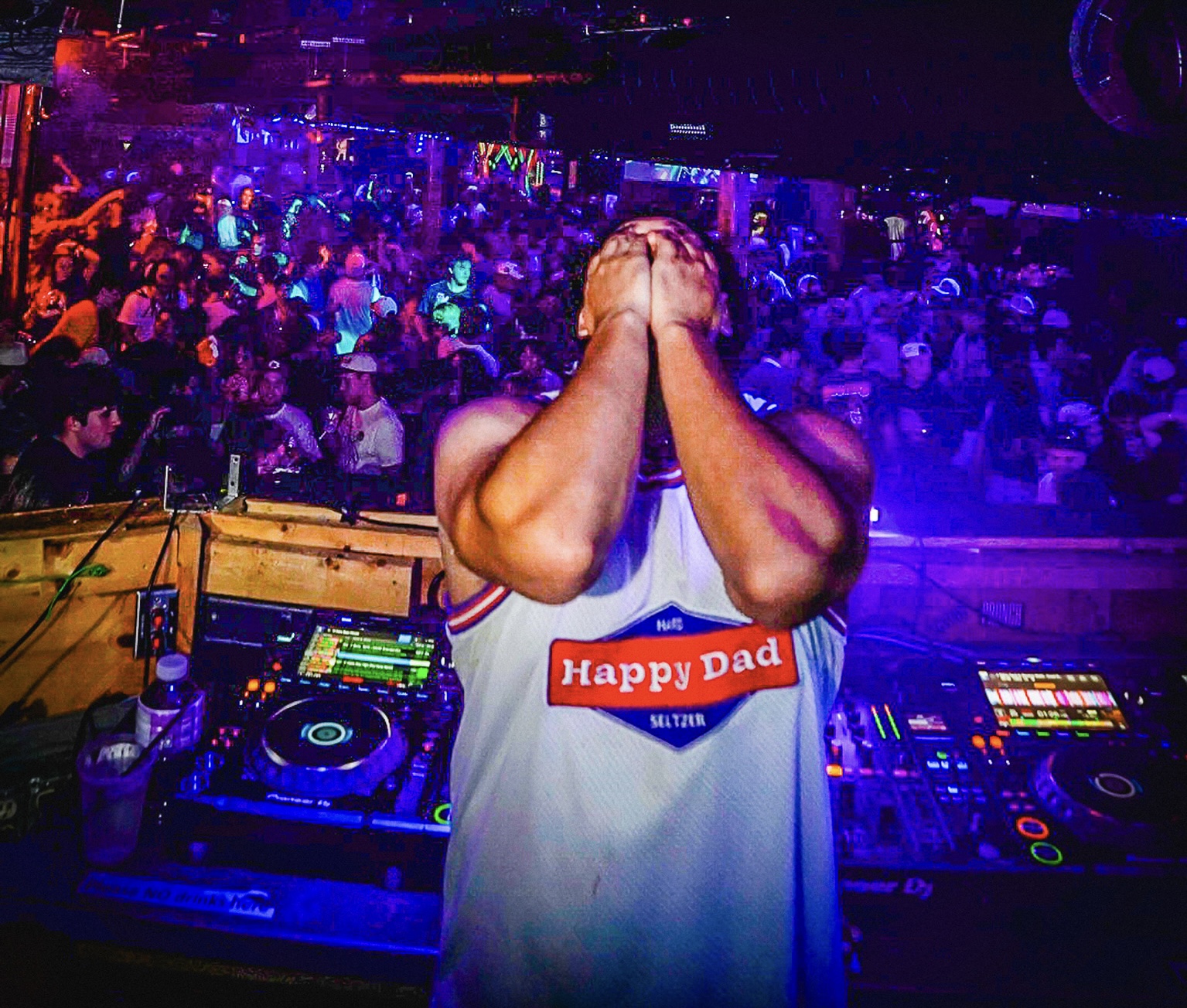 DJ with branded jersey and event audience